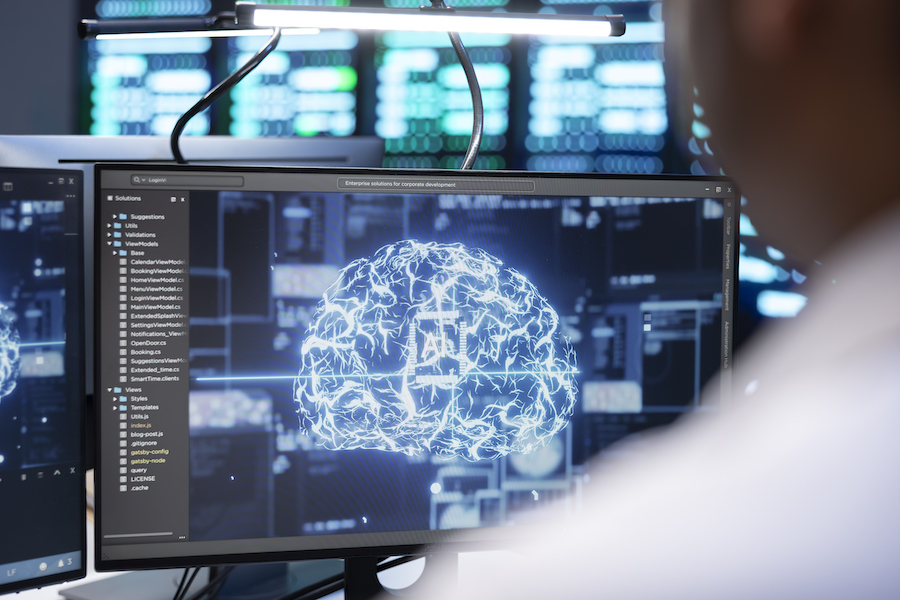 Engineer using AI tech on computer to do checkup in server farm